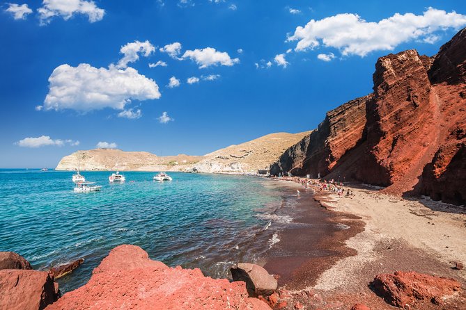 Archaeological Bus Tour to Akrotiri Excavations & Red Beach - Perissa Black Sand Beach: Swimming Time and Easy Food Options