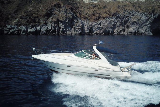 Explore Santorini’s volcano with Alex Private Boat Rental - Oia from the sea: how sunset changes the last part of the cruise