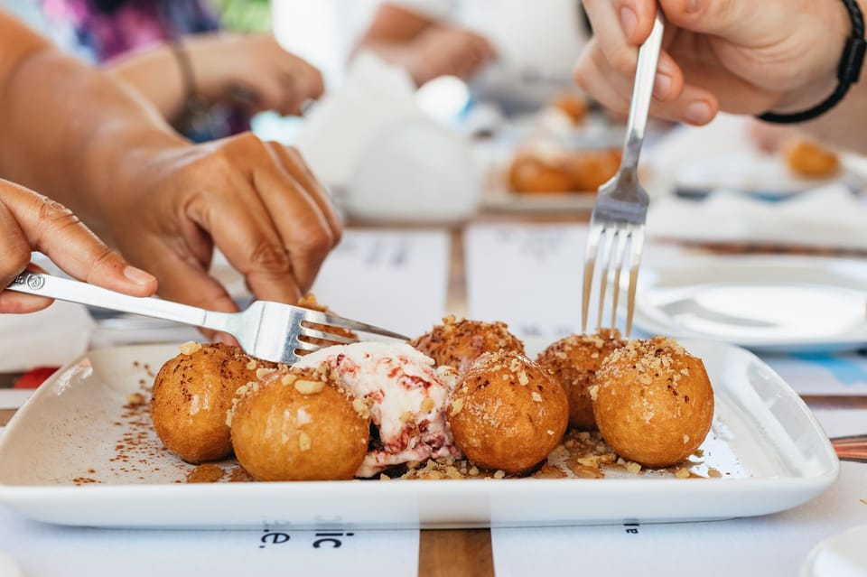 Fira: Guided Foodie Walking Tour with Tastings - Mezes, Loukoumades, and Greek Taverns: Eating Like Locals Rather Than Tourists