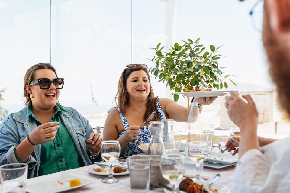 Fira: Guided Foodie Walking Tour with Tastings - Caldera Walk and Volcano Views: The Scenic Pace Between Bites
