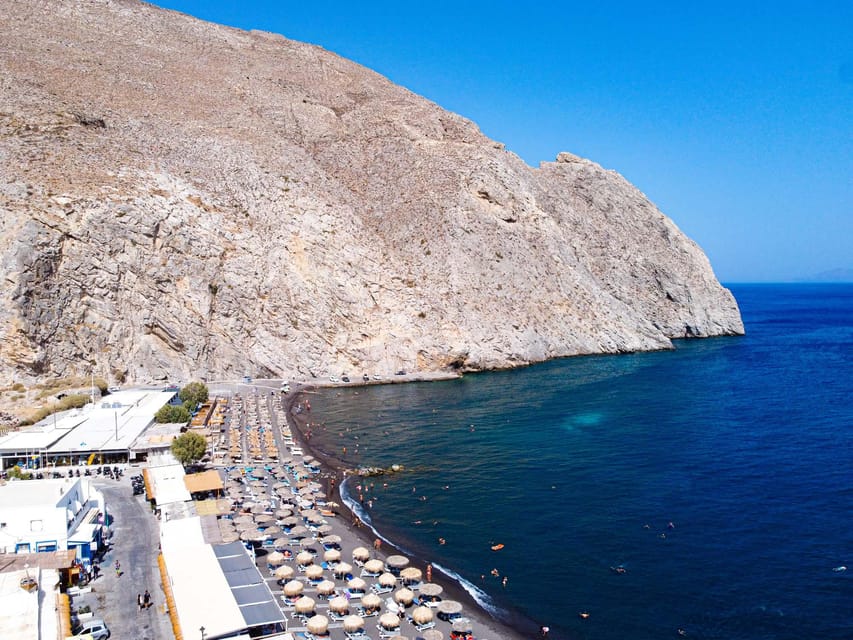 From Fira: Santorini Highlights Minibus Tour with Oia Sunset - The Lighthouse and Red Beach: Where the Island Looks Like It’s Been Painted