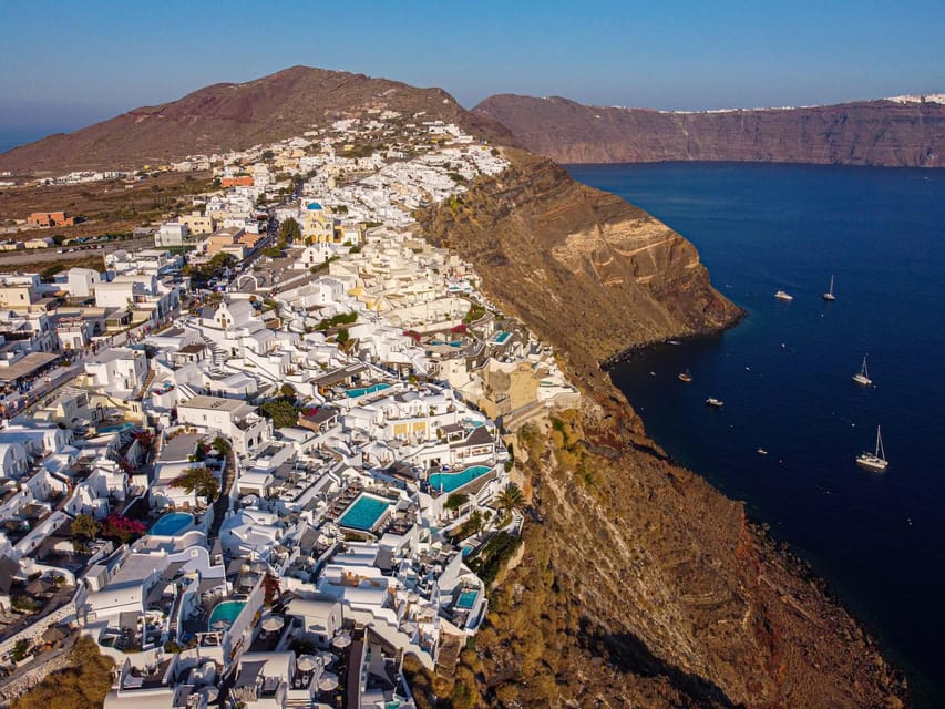 From Fira: Santorini Highlights Minibus Tour with Oia Sunset - Perissa Beach Free Time on Volcanic Black Sand