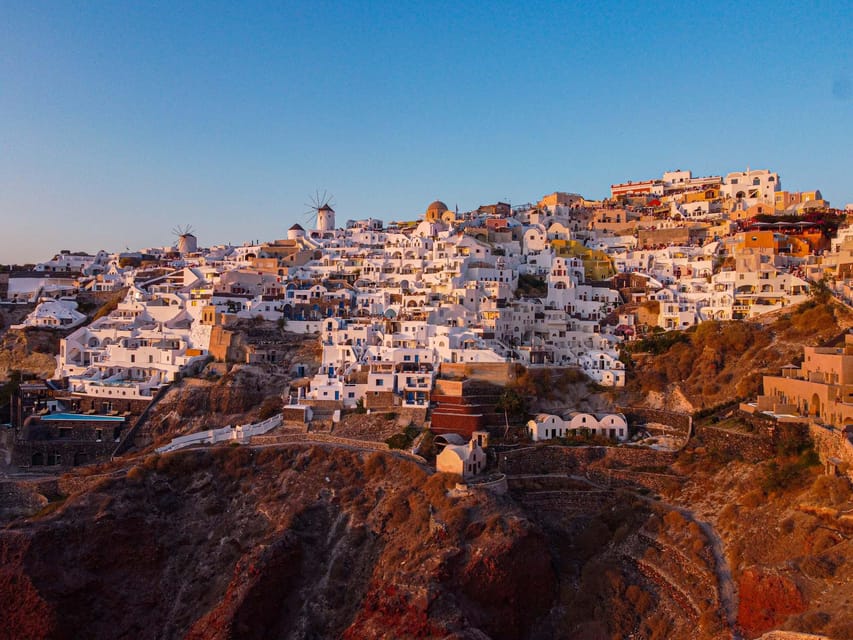 From Fira: Santorini Highlights Minibus Tour with Oia Sunset - Minibus Comfort, English Driver Storytelling, and Group Reality