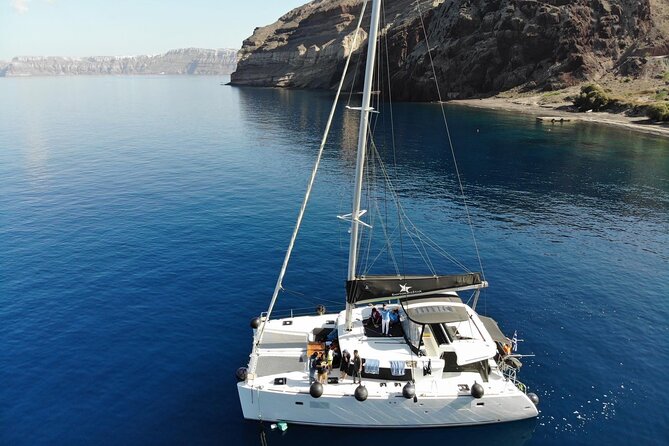 Half-Day Exclusive Catamaran Cruise in Santorini with Meal and Open Bar - The open bar mood: Prosecco, wine, beer, and an easy party rhythm