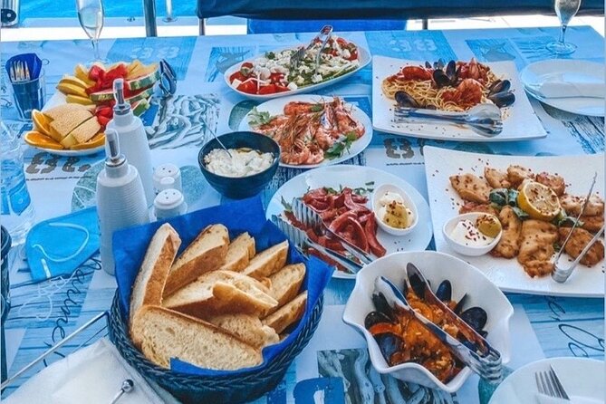 Half-Day Exclusive Catamaran Cruise in Santorini with Meal and Open Bar - Santorini hot springs: warm water, short time, real sea experience