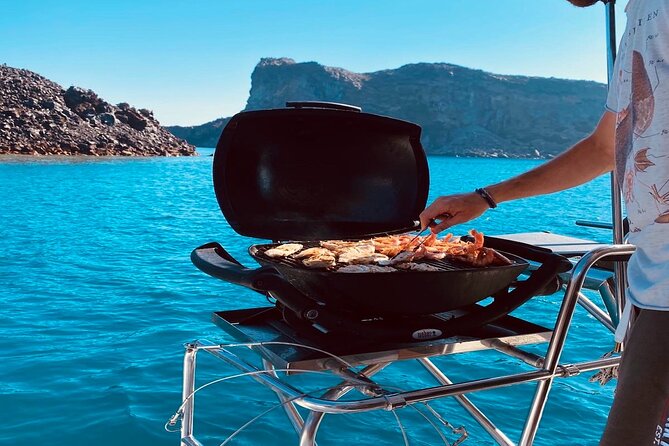 Half-Day Exclusive Catamaran Cruise in Santorini with Meal and Open Bar - Thirassia Island: snorkel time plus the best part of the meal day