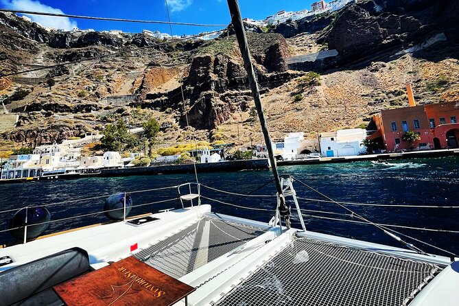 Half Day Premium Catamaran Cruise in Santorini including Oia - BBQ dinner and open bar: why food inclusion changes the value