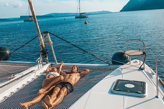 Half Day Premium Catamaran Cruise in Santorini including Oia - Boat size, crowd levels, and the reality of short swim windows