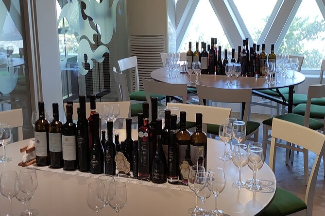 Private Wine Tour in 3 Wineries with 12 Wine Tastings and Tapas - Stop 3 at Venetsanos: gravity-fed production and sunset on the caldera cliffs