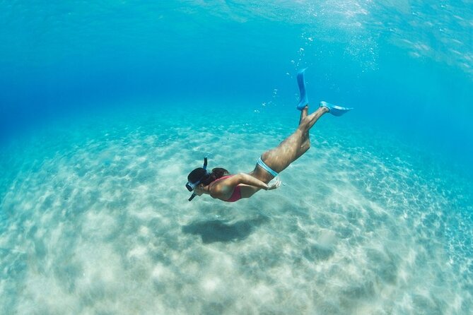 Santorini: Caldera Classic Semi-Private Cruise with BBQ & Drinks - Stop 1: Red Beach—volcanic colors and an easy snorkel window