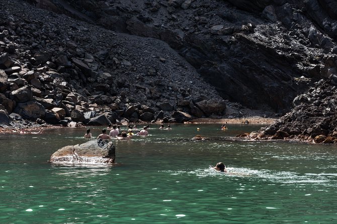 Santorini Caldera Cruise Tour (Volcano, Hot Springs, Thirassia) - Palea Kameni hot springs swim: warm water expectations and real safety tips