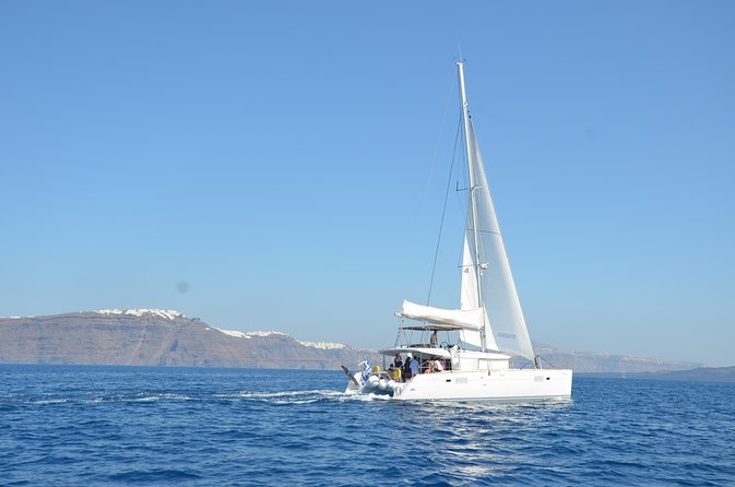 Santorini Caldera Gold Day Cruise with BBQ on board and Open Bar - Sailing the Akrotiri lighthouse and the caldera edges