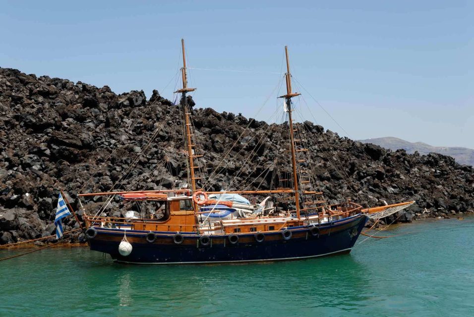 Santorini Caldera: Sunset Cruise with Dinner - Dinner on board: buffet meal, crew service, and the vibe