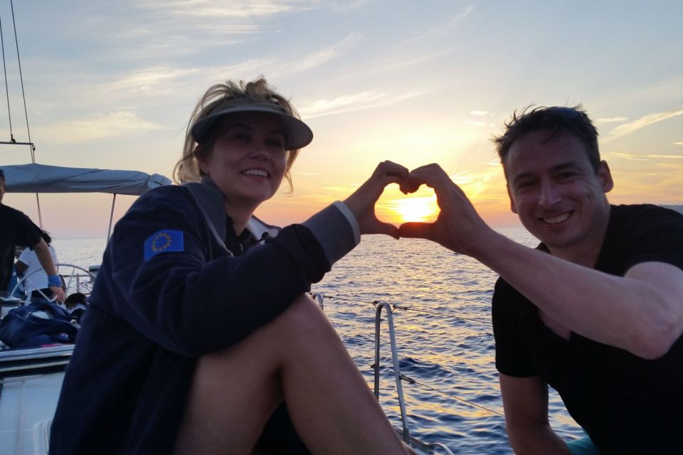 Santorini Caldera: Sunset Sailing Cruise with Meal - Sailing past Red Beach and White Beach without the road crowds