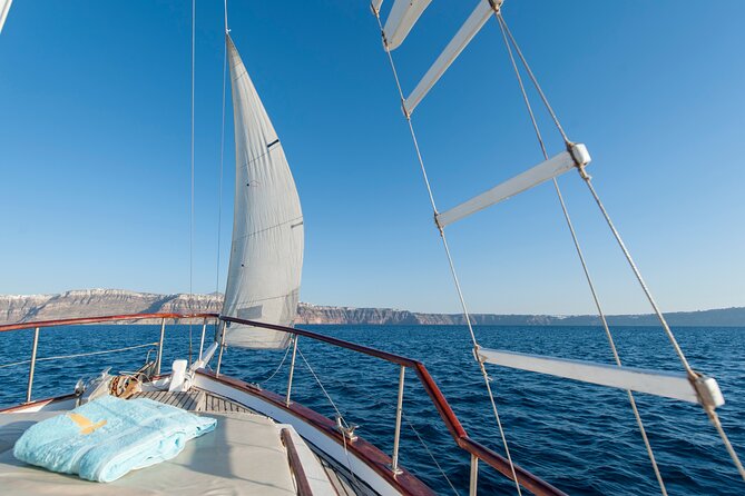 Santorini Caldera Sunset Traditional Cruise with Meal and Drinks - Mesa Pigadia, Black Mountain, and Indian Rock: the quick scenic pulse