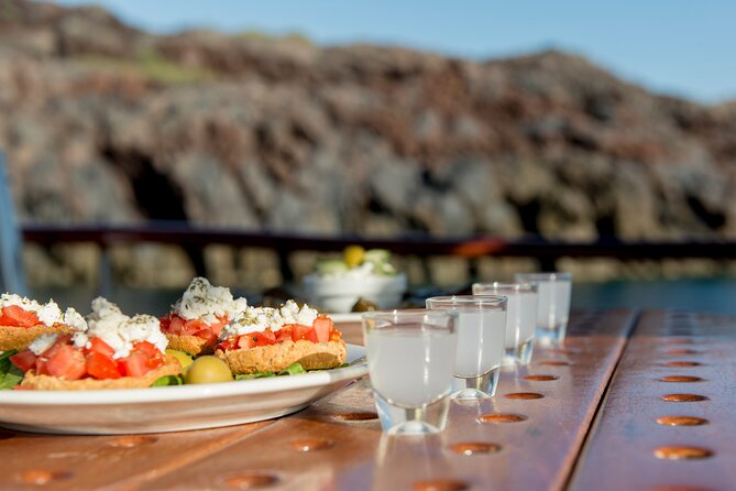 Santorini Caldera Sunset Traditional Cruise with Meal and Drinks - Red Beach: iron-stained colors and a second swimming chance