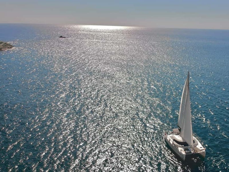 Santorini: Catamaran Cruise with Food and Drinks - Onboard Vibes: Music, Nets, and Finding Your Spot
