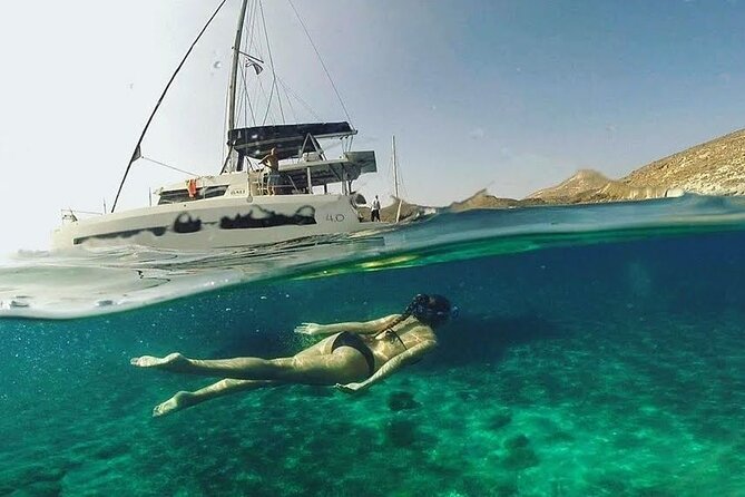 Santorini Catamaran Cruise with Fresh Meal and Open Bar - Booking timing and what the sunset option changes