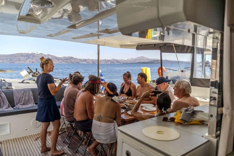 Santorini: Catamaran Cruise with Fresh Meal & Open Bar - Santorini Volcano stop: photos, then back in the water