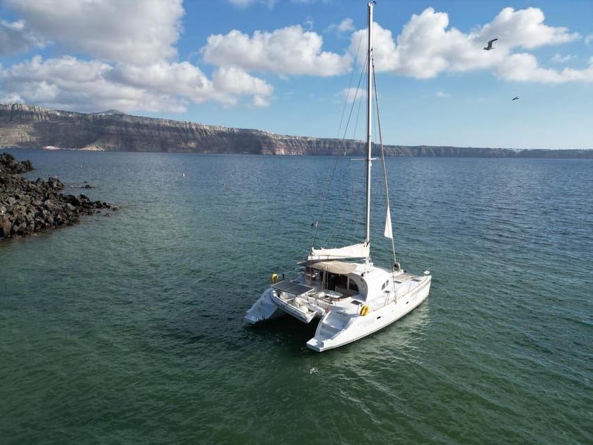 Santorini: Catamaran Cruise with Greek BBQ and Drinks - Nea Kameni and the hot springs: relaxing in sulphur waters, not a spa fantasy