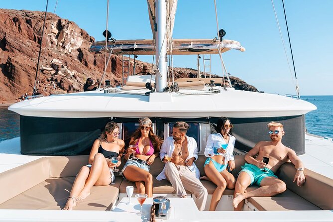 Santorini Catamaran Cruise: with Lunch, BBQ, Open Bar, Transfers - Sailing highlights: White Beach, Indian Rocks, and the Venetian Lighthouse views