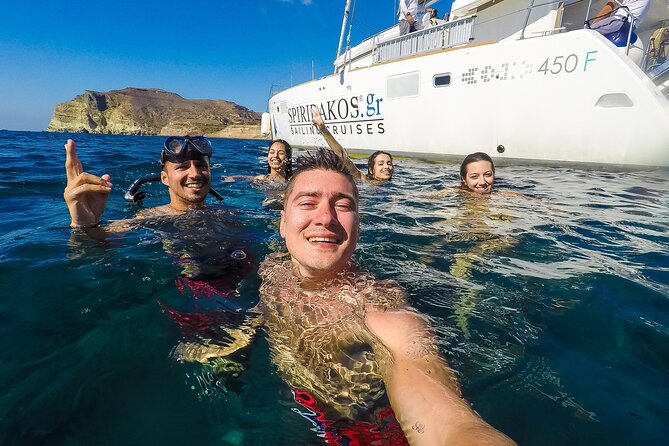 Santorini Classic Catamaran Cruise with BBQ, Drinks and Transfers - Palea Kameni hot springs: warm sulfur water and the “get there by swim” rule