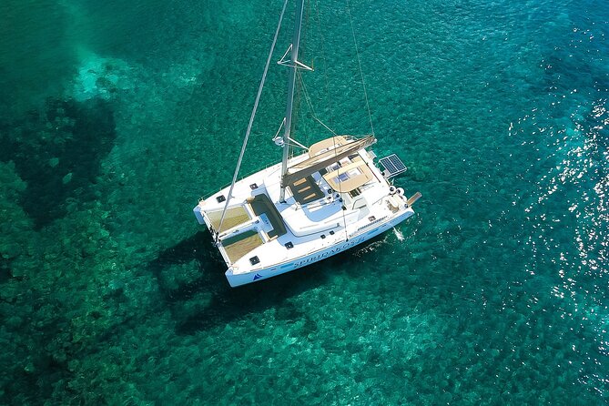 Santorini Classic Catamaran Cruise with BBQ, Drinks and Transfers - Volcano talk, the Santorini swim hour, and BBQ timing on the water