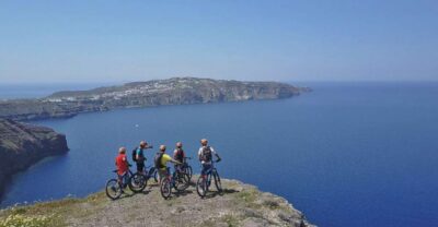 Santorini: Electric Mountain Bike Adventure - Starting at Perivolos: black-sand beach warm-up and easy momentum