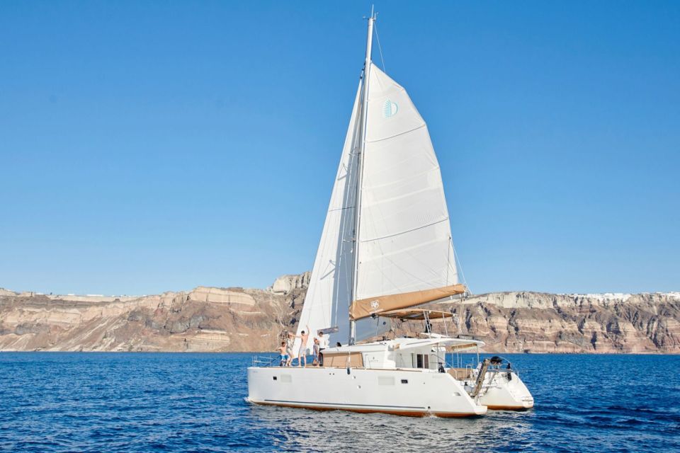 Santorini Gold Catamaran Cruise with Snorkel, BBQ & Open Bar - Open white wine bar + Greek meze + BBQ: why the price can make sense