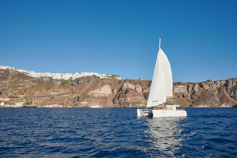 Santorini Gold Catamaran Cruise with Snorkel, BBQ & Open Bar - The crew and safety vibe: comfort without feeling stiff