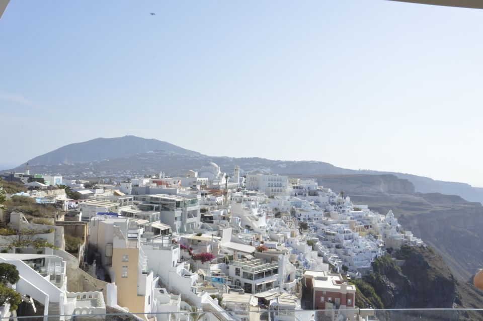 Santorini: Half-Day Sightseeing Tour with Hotel Pickup - Oia on the clock: castle streets, shopping lanes, and real photo time
