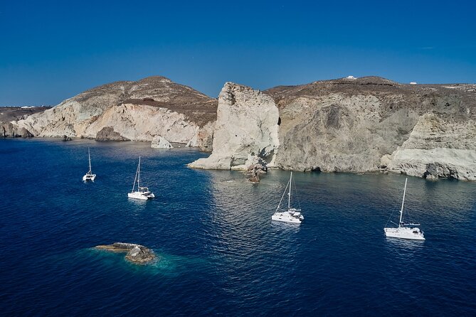 Santorini: Luxury Catamaran Cruise with Fresh Fish BBQ & Drinks - Stop 1: Red Beach Snorkeling and the Photo-Worthy Volcanic Colors