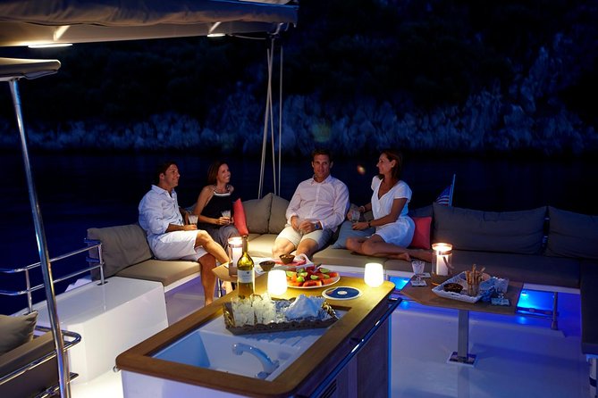 Santorini Luxury Catamaran Sunset Cruise with BBQ, Drink and Transfer - Hot Springs swim near the volcano: short stop, warm water payoff