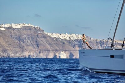 Santorini Luxury Sailing Catamaran Cruise with BBQ, Drinks and Transfer - Ancient lighthouse views from the sea (and why this stop is worth it)