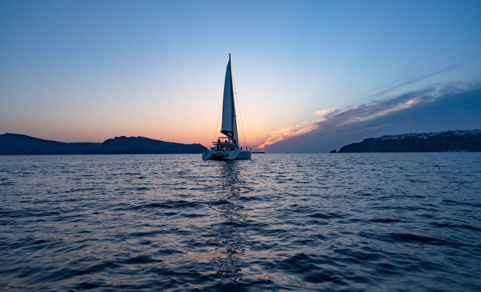 Santorini: Luxury Sunset Cruise with Dinner & Open Bar - Entering Santorini by catamaran: why Ammoudi changes the feel