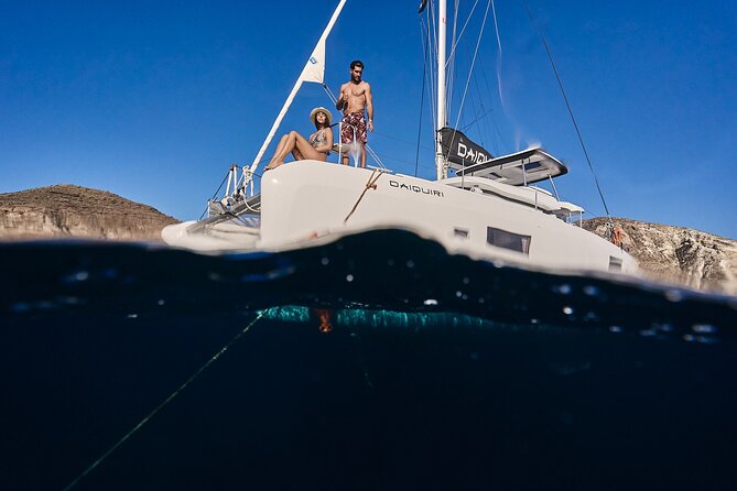 Santorini Oia: Luxury Sunset Cruise with Fresh Fish BBQ & Drinks - Mesa Pigadia Beach: secluded black sands and clear water