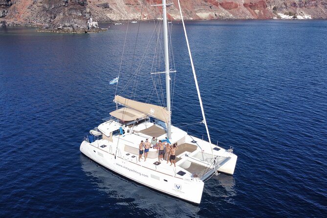 Santorini Platinum Catamaran Cruise with Meal, BBQ and Open Bar - Red Beach: the cliff colors stop being “photos” and start being real