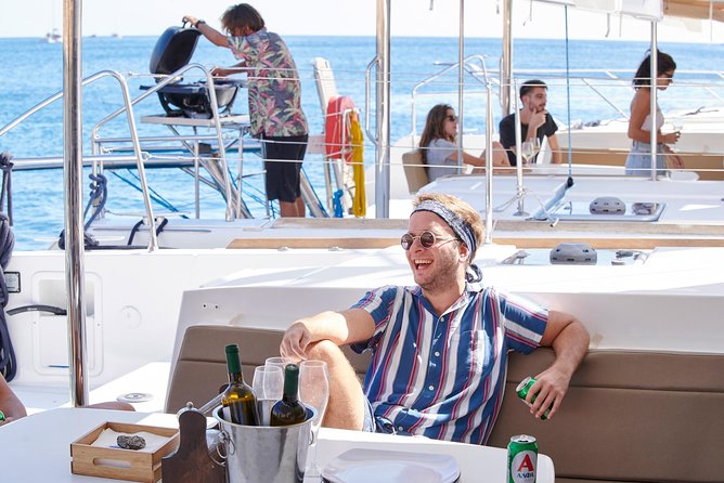 Santorini Platinum Catamaran Cruise with Meal, BBQ and Open Bar - White Beach and sailing moments: the quick hit of contrast
