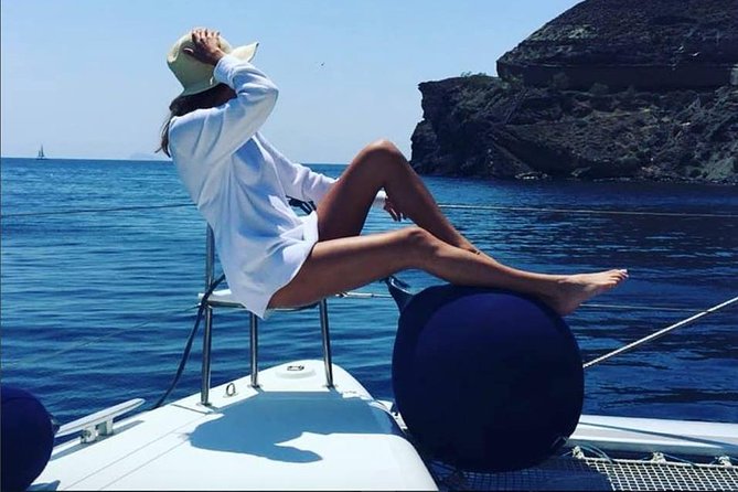 Santorini Platinum Catamaran Cruise with Meal, BBQ and Open Bar - Santorini volcano hot springs: caves, volcanic beaches, and 30 minutes