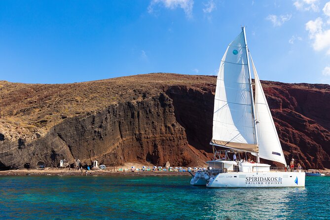 Santorini Private Catamaran Cruise with BBQ, Open Bar & Transfers - Red Beach and White Beach: two stops that define the day
