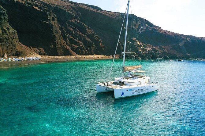 Santorini Private Catamaran Cruise with BBQ, Open Bar & Transfers - Palea Kameni hot springs: warm water, sulfur smell, and real volcano vibes