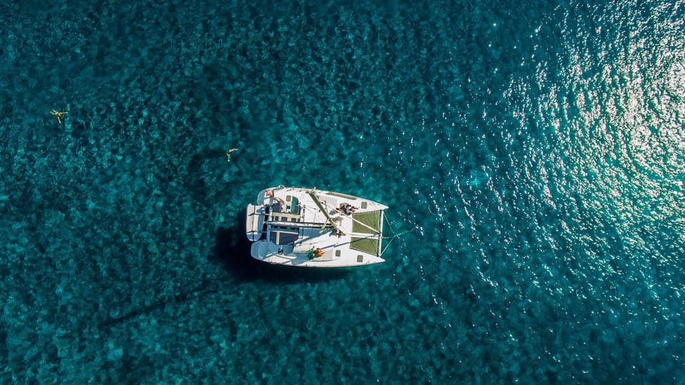 Santorini: Private Catamaran Cruise with Food & Drinks - Vlychada Marina pickup flow and why timing changes by season