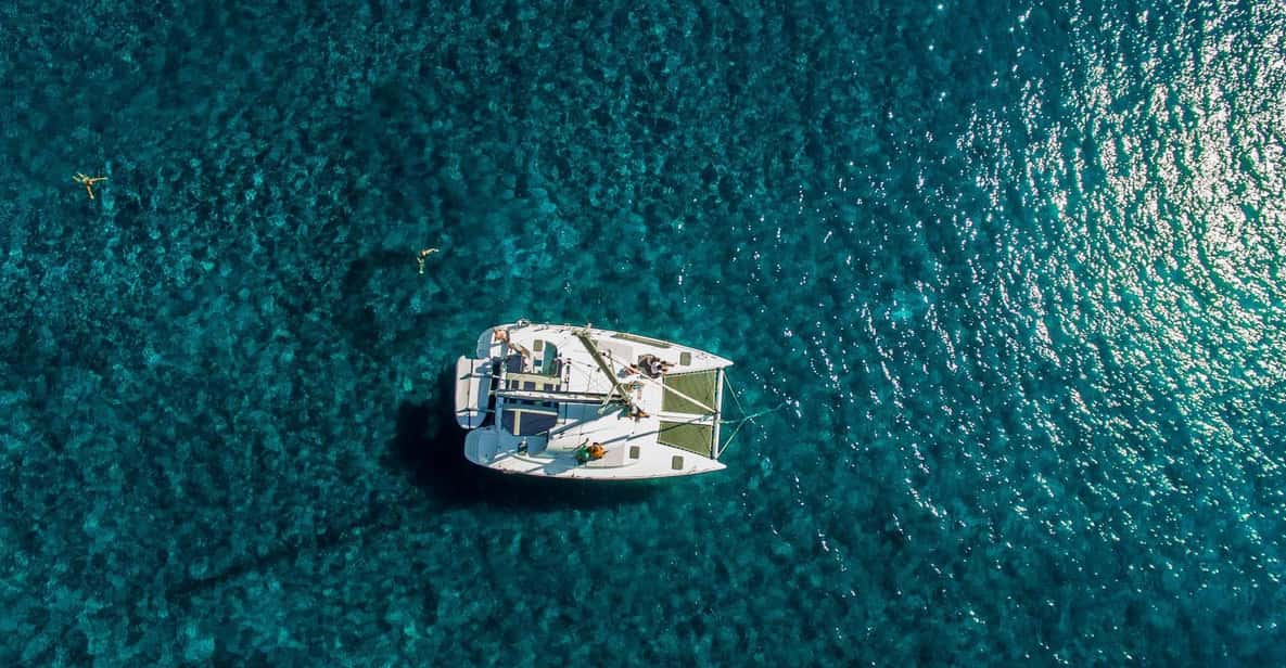 Santorini: Private Catamaran Cruise with Food & Drinks - Mésa Pigádia snorkeling, sunset positioning, and the onboard lunch hour