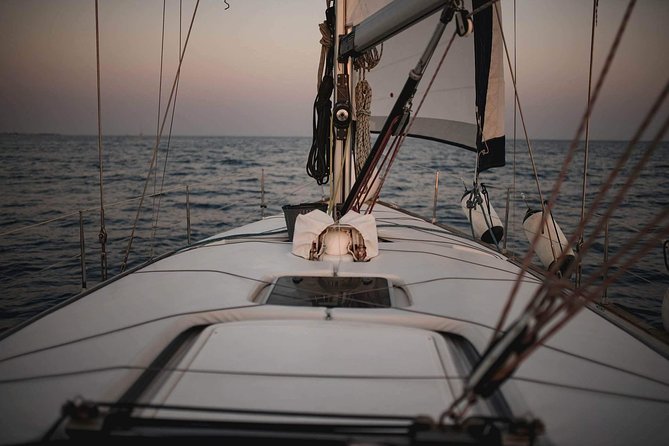 Santorini Private Sunset Sailing Tour with Dinner, Drinks &Transfer included - White Beach by Boat Only: The Volcanic Coast You Can’t Fully Reach