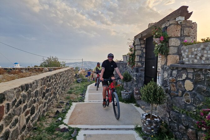 Santorini Small Group Guided E-bike Tour & Local Tomato Museum - Perissa Black Sand Beach: the 5-minute reality check for your camera roll