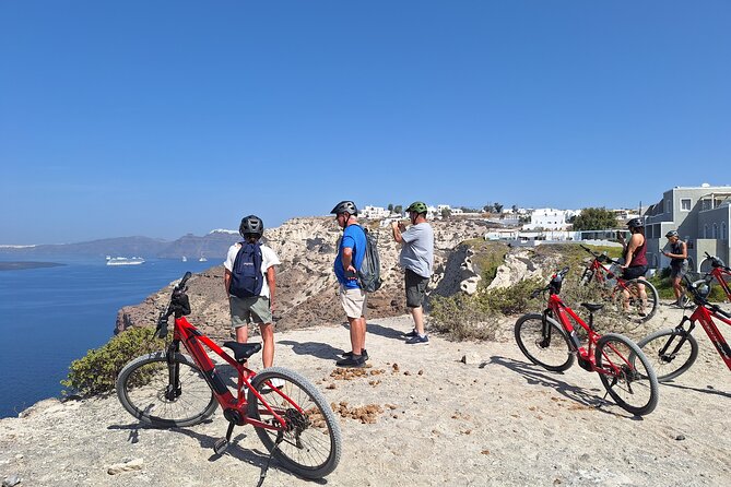Santorini Small Group Guided E-bike Tour & Local Tomato Museum - Vineyards close to the ground: the basket-pruned grape lesson