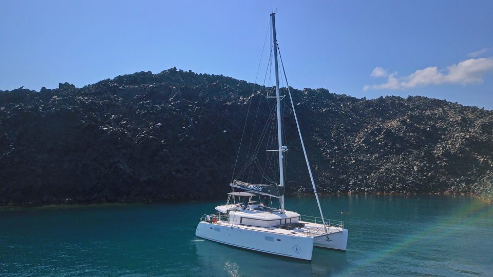 Santorini: Southern Island Luxury Catamaran Cruise with Meal - Akrotiri Lighthouse pass-by: quick history framing from the sea
