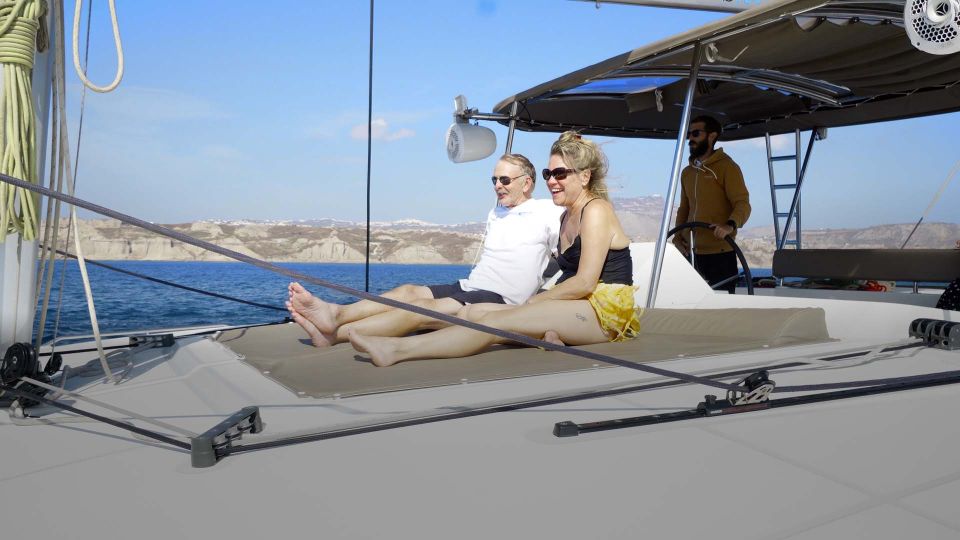 Santorini: Sunset Cruise with Greek Dinner and Transfer - Red Beach and White Beach: Swim and Snorkel Without a Full Day Detour