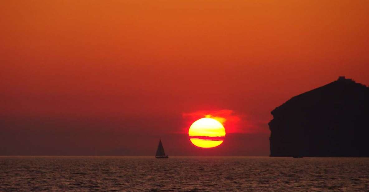 Santorini: Sunset Cruise with Greek Dinner and Transfer - Sunset Time: World-Famous Views Plus Crew Help with Photos
