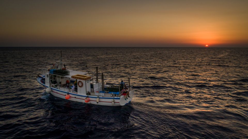 Santorini Sunset Fishing Trip with Dinner and Drinks - From shrimp nets to fishing lines: how the crew runs the work